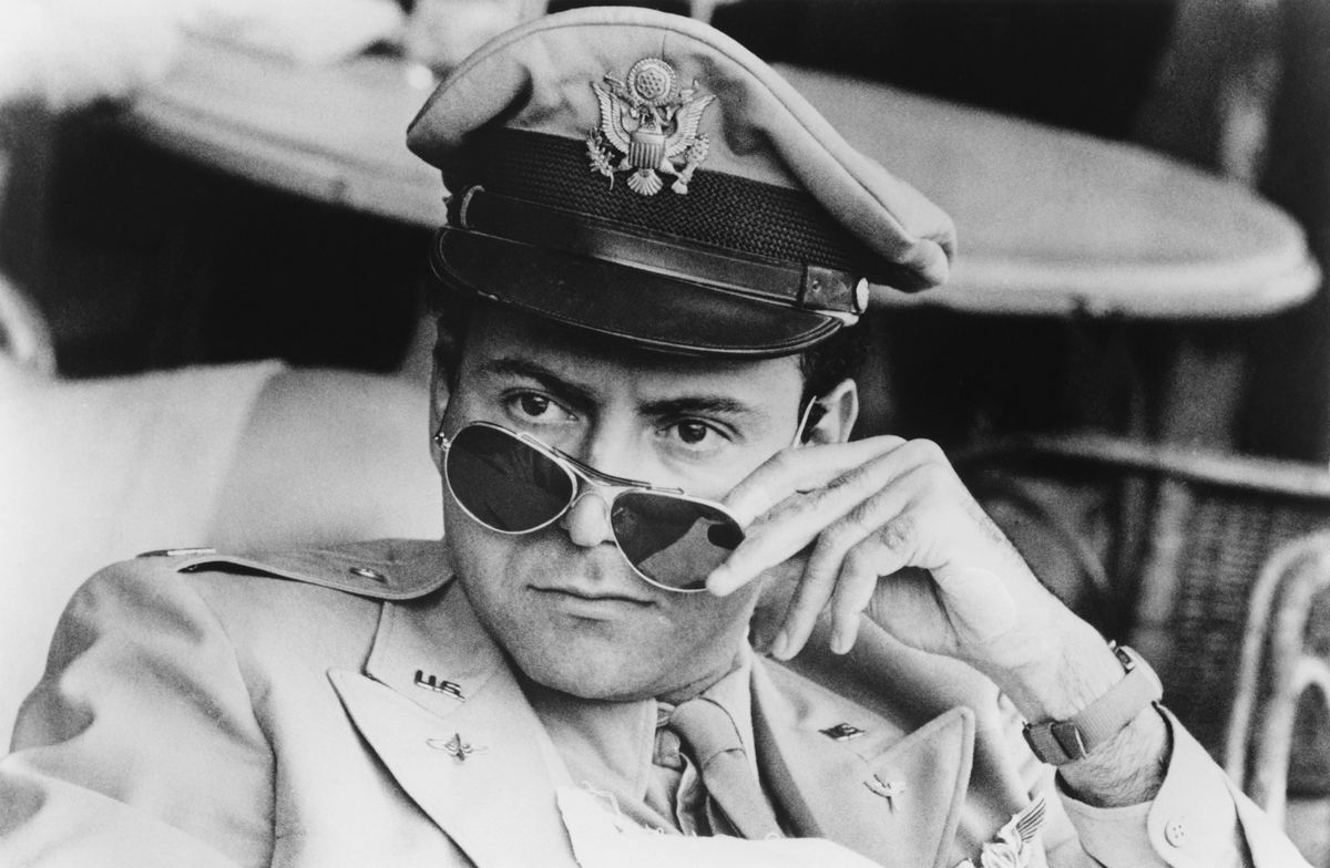 Alan Arkin wearing a uniform and sunglasses in Catch-22