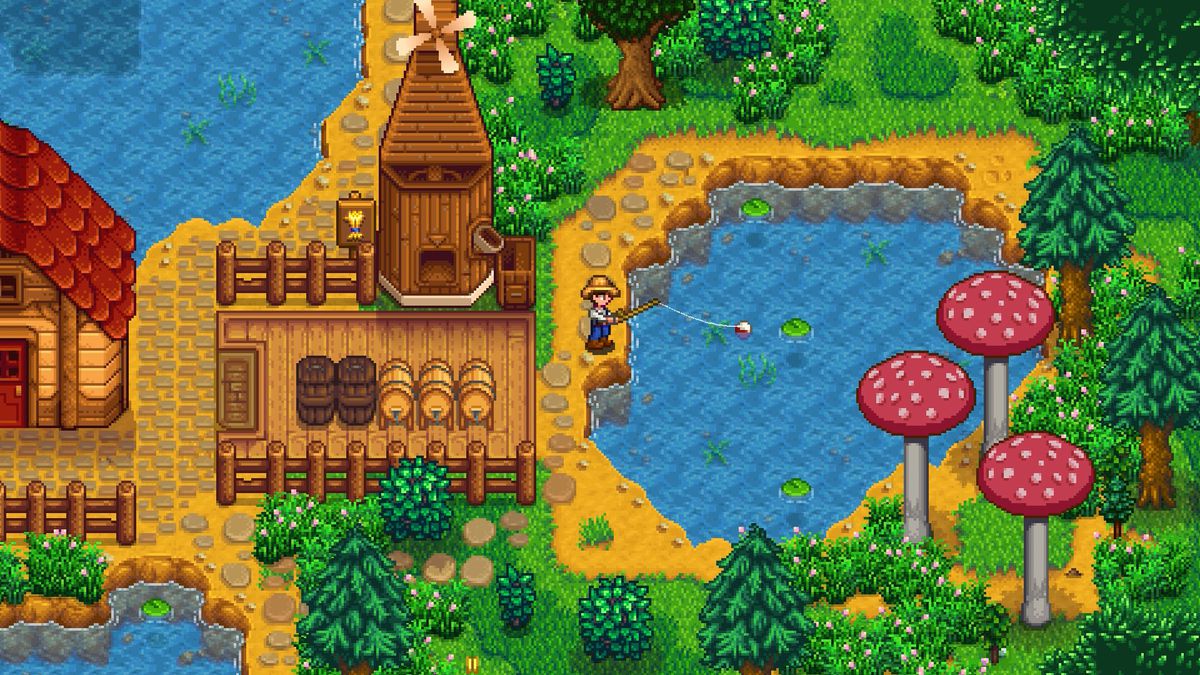 The player character fishes in Stardew Valley on their farm next to a mill and some giant mushrooms.