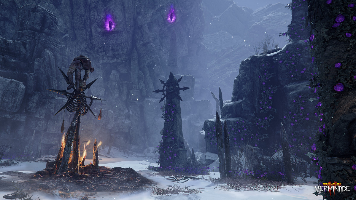 A screenshot from Vermintide 2, showing shrines built to Chaos built in a snowy winter valley