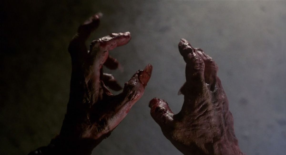 A close-up of the damaged, bloody hands of Giorgio in Castle Freak