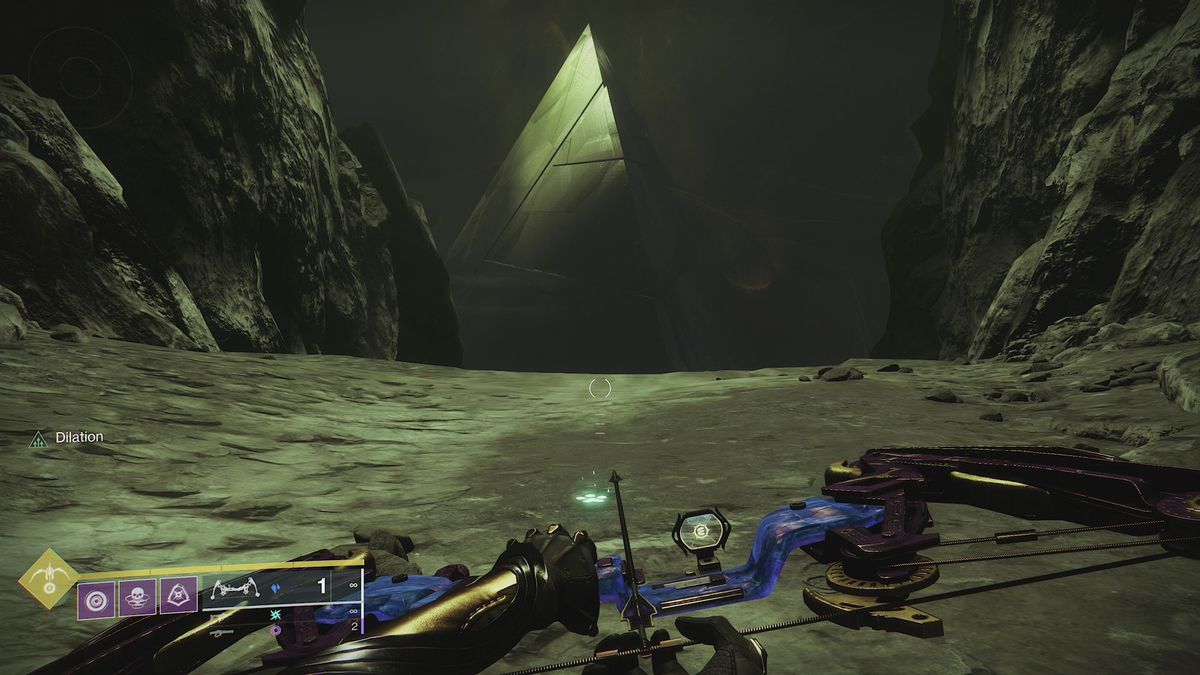 A paw print in front of the Pyramid ship on the Moon in Destiny 2