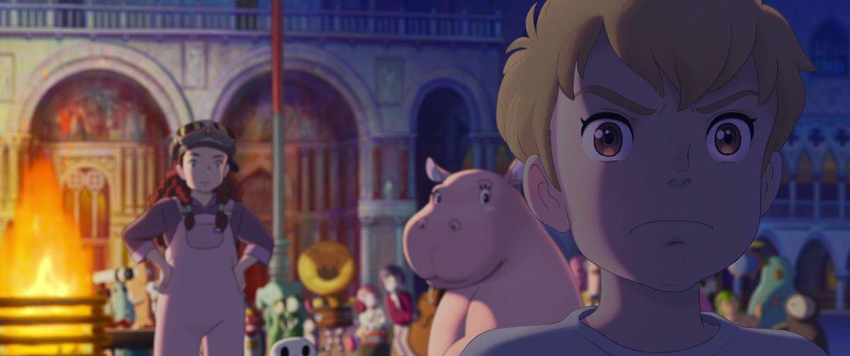 A blond haired anime boy with brown years stares intently at something off-screen as a group of colorful characters including a red-haired girl and a pink hippo look at him from a campfire in The Imaginary.