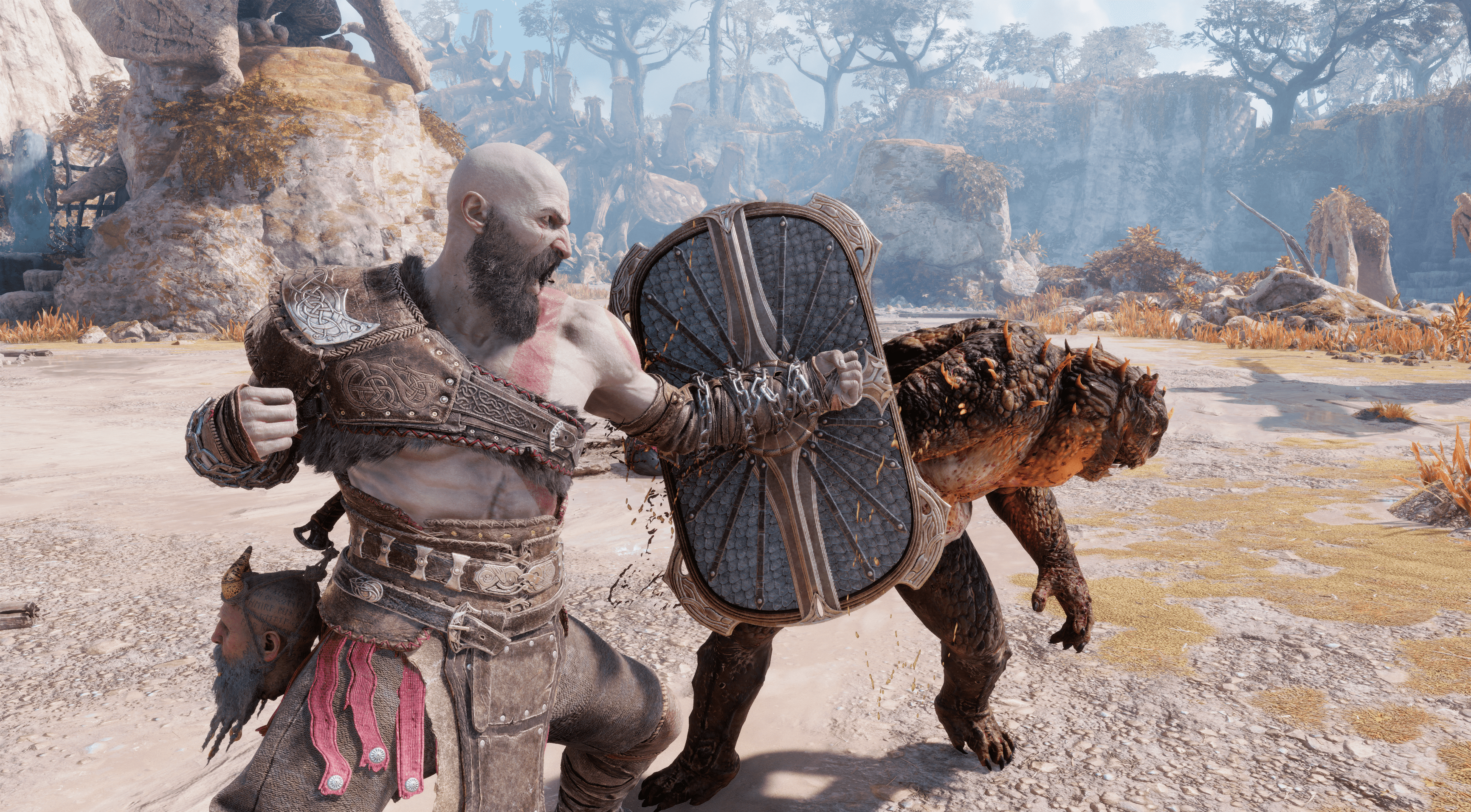 Kratos winds his right fist back to punch a lizard monster in God of War Ragnarok.